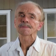 Buck Buchanan Man with a salt-and-pepper mustache and thinning hair